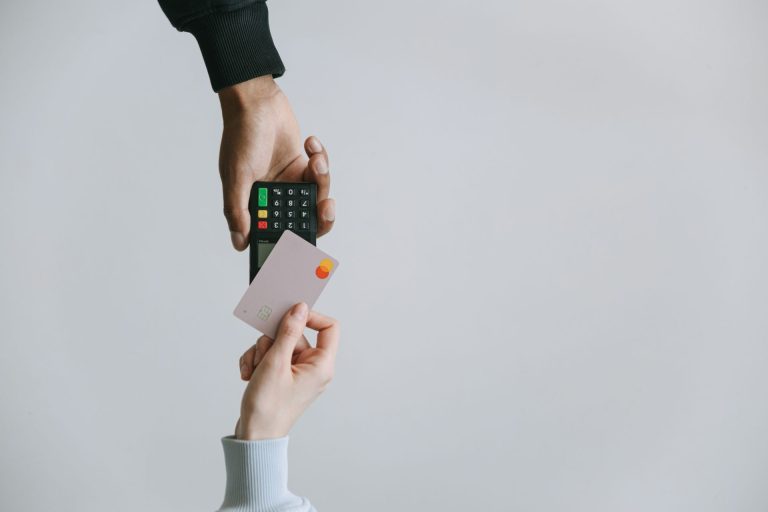 Person paying a bill with a credit card